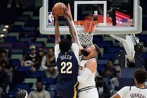 New Orleans Pelicans center Derik Queen (22) goes to the basket against Denver Nuggets center Jonas Valanciunas (17) in the second half of an NBA basketball game in New Orleans. 