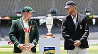 Photo: Dave Hunt/AAP Image via AP : The Ashes Live Score, Australia Vs England 1st Test Day 1: Captains Steve Smith, left, and Ben Stokes pose with the Waterford Crystal trophy in Perth.