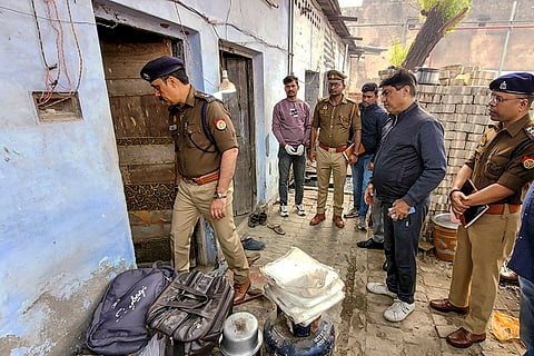 Police personnel at the site where four workers of an oil factory allegedly died due to lack of oxygen caused by coal being burned in a closed room, in Kanpur, Uttar Pradesh.