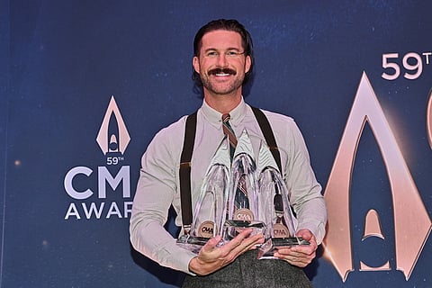 Riley Green poses in the press room during the 59th Annual Country Music Association Awards at Bridgestone Arena in Nashville, Tennessee. 