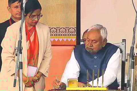 JD(U) supremo Nitish Kumar after taking oath as the Bihar Chief Minister during the swearing-in ceremony, at Gandhi Maidan in Patna. 