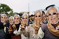 How A Weakened Opposition In Bihar Softened Nitish Kumar's Grip On The State | Photo: PTI : The Loyalists: JD(U) supporters wearing masks of Nitish Kumar at a rally in Gaya