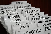 Fernando Llano : Name cards for countries sit on a table at the COP30 U.N. Climate Summit, Thursday, Nov. 13, 2025, in Belem, Brazil. 