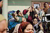 | Photo: Yasir Iqbal : In Mourning: Grieving family members of Nowgam blast victims