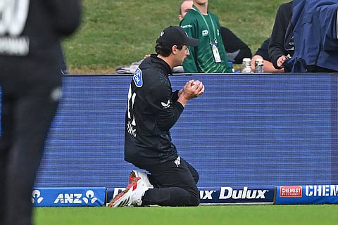 New Zealand's Matt Henry takes a catch to dismiss the West Indies' Romario Shepherd during their One Day International cricket match in Napier, New Zealand.