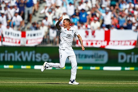 England's Brydon Carse celebrates the wicket of Australia Usman Khawaja during the first Ashes cricket test match between Australia and England in Perth.
