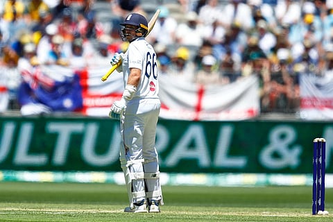 England's Joe Root reacts after losing his wicket during the first Ashes cricket test match between Australia and England in Perth.