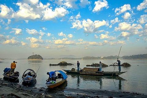 Men park their boats at the Brahmaputra river bank after catching fish, in Guwahati.