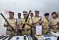 PTI : ADGP (Intelligence) Mahesh Chandra Laddha with other officials shows recovered arms and ammunitions during a press conference, in Vijayawada