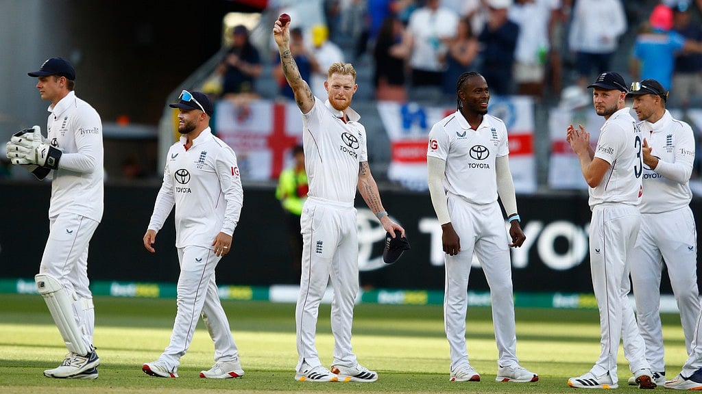 AP : England's captain Ben Stokes, centre, acknowledges the crowd after taking five wickets during the first Ashes Test between Australia and England in Perth.