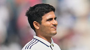 (AP Photo/Aijaz Rahi) : India's captain Shubman Gill reacts as he leaves the field after retired hurt on the second day of the first cricket test match between India and South Africa in Kolkata, India, Saturday, Nov. 15, 2025.