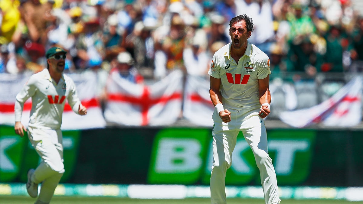 Australia's Mitchell Starc celebrates the wicket of England's Joe Root during the first Ashes cricket test match between Australia and England in Perth, Friday, Nov. 21, 2025. - (AP Photo/Gary Day)