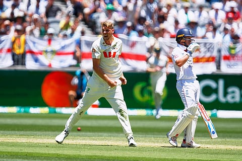Australia's Cameron Green, left, celebrates the wicket of England's Ollie Pope during the first Ashes cricket test match between Australia and England in Perth.