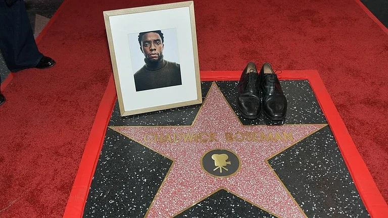 Actor Chadwick Boseman's shoes and portrait are displayed on his newly unveiled star during a posthumous Hollywood Walk of Fame ceremony on the Hollywood Walk of Fame on Thursday, Nov. 20, 2025, in Los Angeles. - Photo by Richard Shotwell/Invision/AP