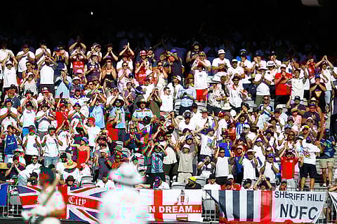 England's fan cheer on their team during the first Ashes cricket test match between Australia and England in Perth.