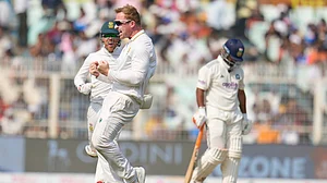 AP : South Africa's Simon Harmer, centre, celebrates the dismissal of India's Rishabh Pant, right, on the third day of the first Test in Kolkata.