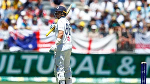 (AP Photo/Gary Day) : England's Joe Root reacts after losing his wicket during the first Ashes cricket test match between Australia and England in Perth, Friday, Nov. 21, 2025.