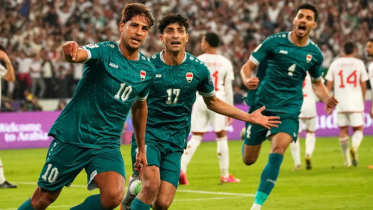 Iraqi's Mohanad Ali celebrates with teammates after scoring his side's first goal during the 2026 World Cup play off second leg match between Iraq and UAE, in Basra on Tuesday, November 18, 2025. - | Photo: AP/Hadi Mizban