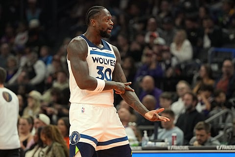 Minnesota Timberwolves forward Julius Randle reacts after scoring against the Phoenix Suns during the first half of an NBA Cup basketball game in Phoenix.