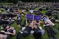 South Africa Declares Gender-Based Violence A National Disaster After Nationwide Protests Misper Apawu : Participants hold signs while lying on the ground during a gender-based violence protest at the forecourt of the botanical gardens in Johannesburg, South Africa, Friday, Nov. 21, 2025.
