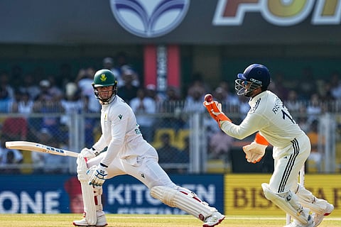 India's captain Rishabh Pant takes the catch of South Africa's Ryan Rickelton on the first day of the second cricket test match between India and South Africa in Guwahati.