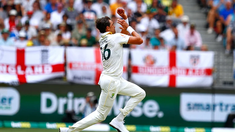 Australia's Mitchell Starc bowls a delivery on day two of the first Ashes cricket test match between Australia and England in Perth, Saturday, Nov. 22, 2025. - (AP Photo/Gary Day)