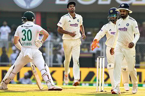 India's players celebrate after dismissal of South Africa's Tristan Stubbs, left, on the first day of the second cricket test match between India and South Africa in Guwahati.