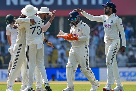 India's players celebrate the dismissal of South Africa's Ryan Rickelton with captain Rishabh Pant, centre, on the first day of the second cricket test match between India and South Africa in Guwahati.
