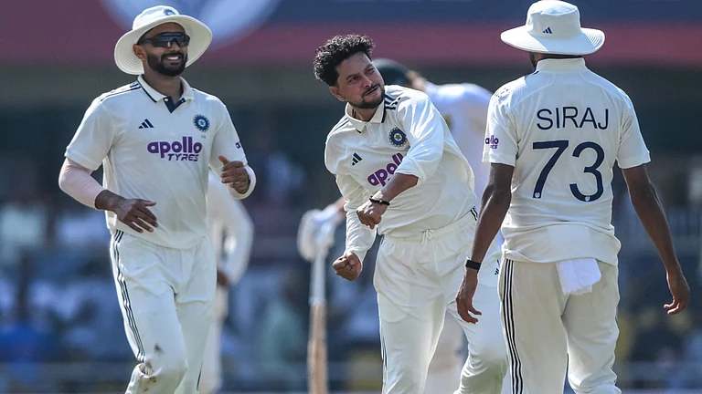 Kuldeep Yadav celebrates the wicket of Ryan Rickelton on day one of the India vs South Africa second Test on November 22, 2025. - null