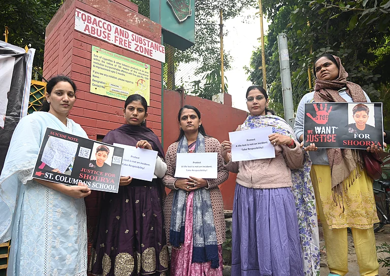 Parents and students with relatives protest outside St Columba s School at Gole Dak Khana demanding justice for class x student Shourya Patil who committed suicide allegedly due to harassment from teachers on November 21, 2025 in New Delhi, India. The protestors asserted that the school must be held accountable and urged the government to strengthen mental health safeguards for students. - IMAGO / Hindustan Times