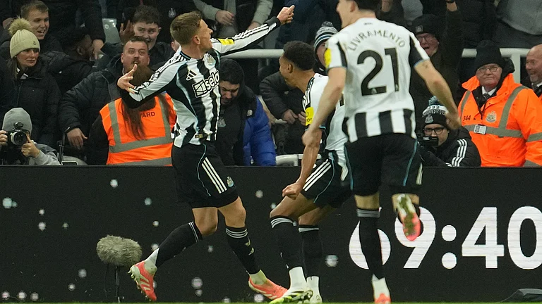 Newcastle United's Harvey Barnes reacts after scoring during the English Premier League match against Manchester City on November 22, 2025. - | Photo: AP/Jon Super