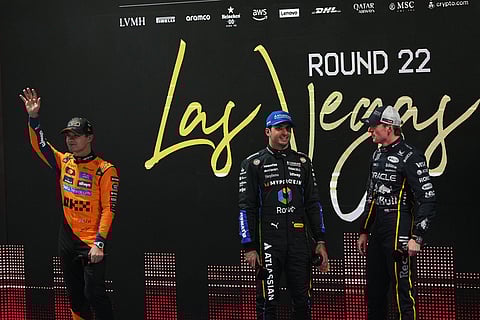 From left, first place finisher McLaren driver Lando Norris of Great Britain, third place finisher Williams driver Carlos Sainz of Spain, and second place finisher Red Bull driver Max Verstappen of the Netherlandspose celebrate after a qualifying session at the Formula One Las Vegas Grand Prix auto race in Las Vegas.