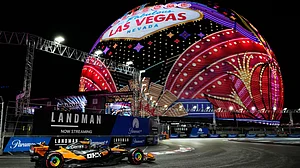 AP/John Locher : McLaren driver Lando Norris of Great Britain drives during a practice session at the Formula One Las Vegas Grand Prix auto race, Friday.