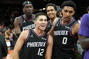 | Photo: AP/Rick Scuteri : Phoenix Suns guard Collin Gillespie (12) celebrates with teammates after hitting the winning shot against the Minnesota Timberwolves during the second half of an NBA Cup basketball game, in Phoenix.