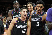 NBA 2025-26: Suns Stun Timbewolves In Last Minute Victory | Photo: AP/Rick Scuteri : Phoenix Suns guard Collin Gillespie (12) celebrates with teammates after hitting the winning shot against the Minnesota Timberwolves during the second half of an NBA Cup basketball game, in Phoenix.