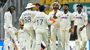Photo: AP : IND Vs SA Live Cricket Score, 2nd Test Day 2: Mohammed Siraj, second right, celebrates the dismissal of Tony de Zorzi with teammates in Guwahati.