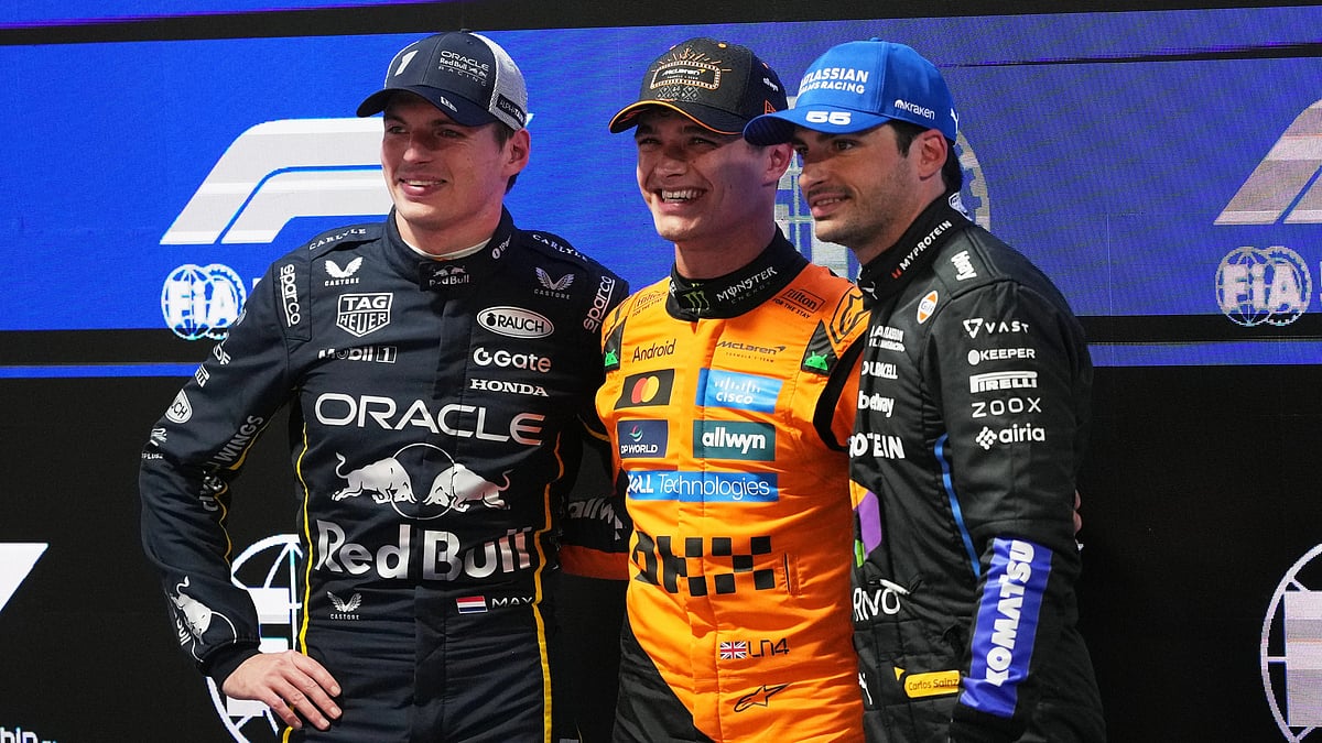 From left, second place finisher Red Bull driver Max Verstappen of the Netherlands, first place finisher McLaren driver Lando Norris of Great Britain, and third place finisher Williams driver Carlos Sainz of Spain pose for a photo after a qualifying session - AP/Eric Gay