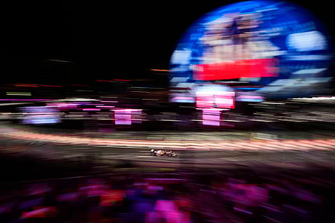 Ferrari driver Charles Leclerc of Monaco drives during a qualifying session at the Formula One Las Vegas Grand Prix auto race in Las Vegas. 