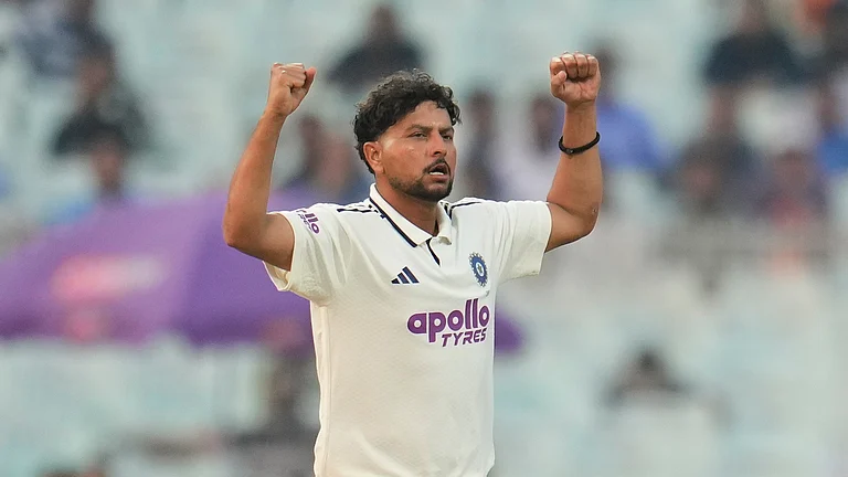 India's Kuldeep Yadav celebrates the dismissal of South Africa's Marco Jansen on the second day of the first cricket test match between India and South Africa in Kolkata, India, Saturday, Nov. 15, 2025. - (AP Photo/Aijaz Rahi)