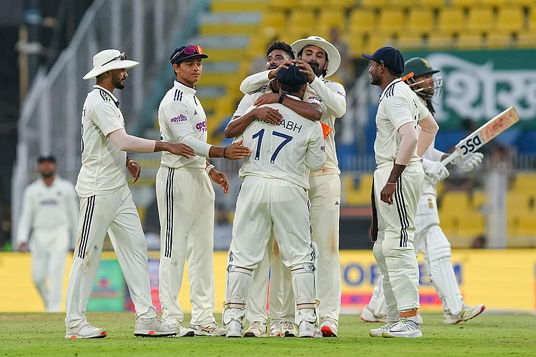 India’s players celebrate the wicket of South Africa’s Tony de Zorzi on day one of the second Test cricket match of a series between India and South Africa, at ACA Stadium, Barsapara, in Guwahati. - | Photo: PTI/Shahbaz Khan