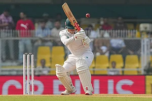 | Photo: PTI/Shahbaz Khan : South Africa's Kyle Verreynne ducks the ball during the day two of the second Test cricket match of a series between India and South Africa, at ACA Stadium in Guwahati.