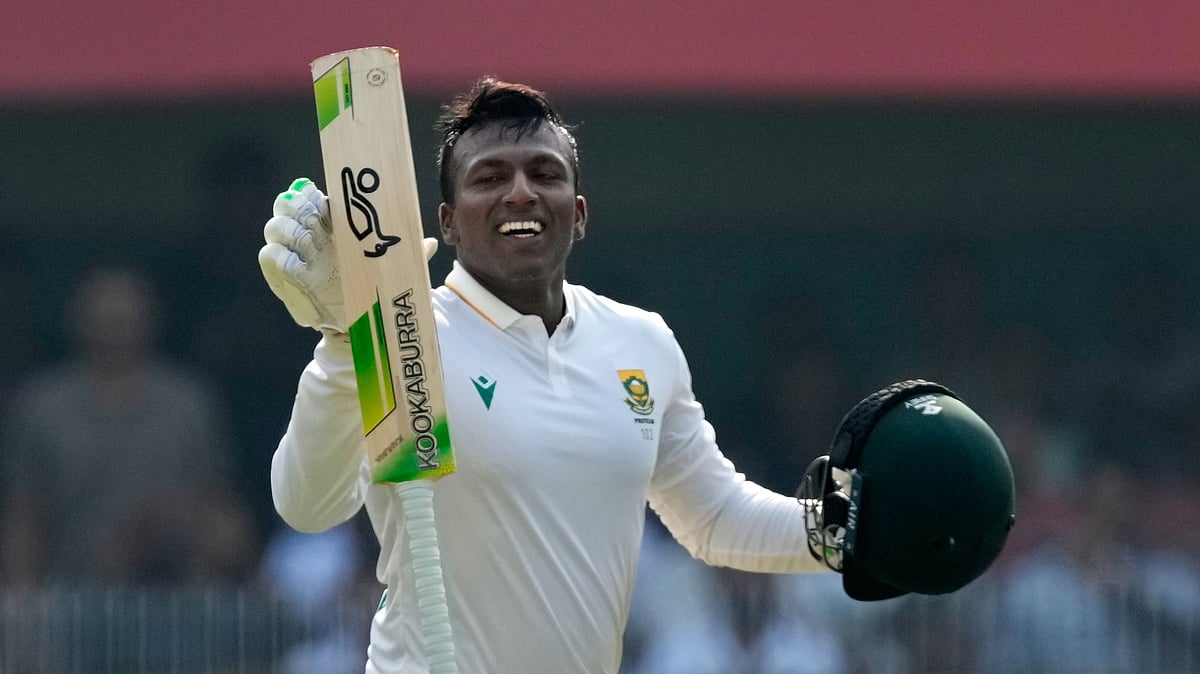 South Africa's Senuran Muthusamy celebrates after scoring a century on the second day of the second cricket test match between India and South Africa in Guwahati, India, Saturday, Nov. 22, 2025. - (AP Photo/Anupam Nath)