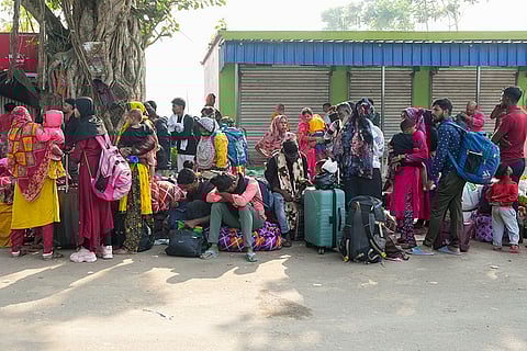 Bangladeshi nationals, who allegedly entered Indian territory illegally, await to return to their homeland following the implementation of the special intensive revision (SIR) of electoral rolls, at Hakimpur checkpost in North 24 Parganas district, West Bengal.