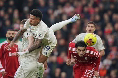 Nottingham Forest's Igor Jesus, centre, challenges for the ball with Liverpool's Curtis Jones during the English Premier League soccer match between Liverpool and Nottingham Forest in Liverpool, England.