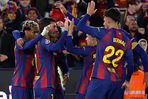 Barcelona p;ayers celebrate after a goal during a La Liga soccer match between Barcelona and Athletic in Barcelona, Spain.