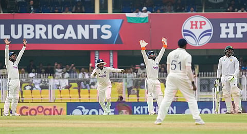 Indian players make an unsuccessful appeal for the wicket of South Africa's Senuran Muthusamy during the day two of the second Test cricket match of a series between India and South Africa, at ACA Stadium in Guwahati.