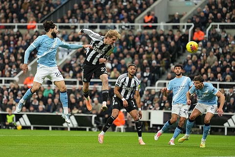 Newcastle's Nick Woltemade tries a header during a Premier League soccer match between Newcastle United and Manchester City in Newcastle, England.