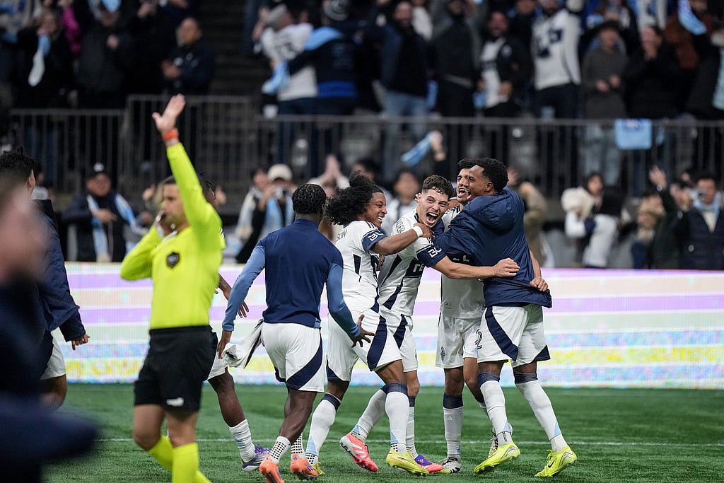 Vancouver Whitecaps' Jayden Nelson, back left to right, Sebastian Berhalter, Mathias Laborda and Ali Ahmed celebrate after Vancouver defeated Los Angeles FC during penalty kicks in the MLS Western Conference semifinal playoff soccer match,  in Vancouver, British Columbia. - | Photo: Darryl Dyck/The Canadian Press via AP