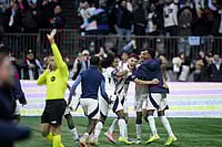 | Photo: Darryl Dyck/The Canadian Press via AP : Vancouver Whitecaps' Jayden Nelson, back left to right, Sebastian Berhalter, Mathias Laborda and Ali Ahmed celebrate after Vancouver defeated Los Angeles FC during penalty kicks in the MLS Western Conference semifinal playoff soccer match,  in Vancouver, British Columbia.