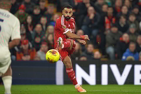 Liverpool's Mohamed Salah kicks the ball during the English Premier League soccer match between Liverpool and Nottingham Forest in Liverpool, England.